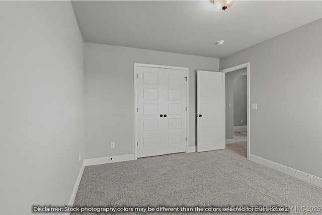 unfurnished bedroom with carpet floors and a closet