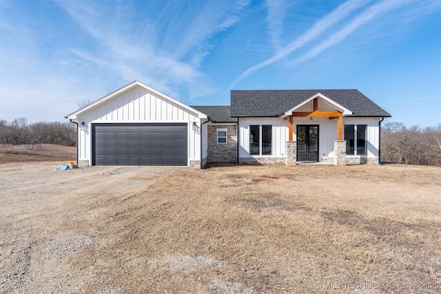 modern farmhouse style home featuring a garage