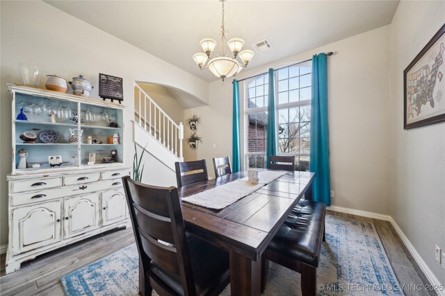 dining space with an inviting chandelier