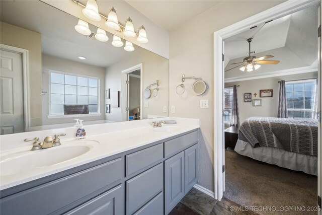 bathroom featuring ceiling fan and vanity