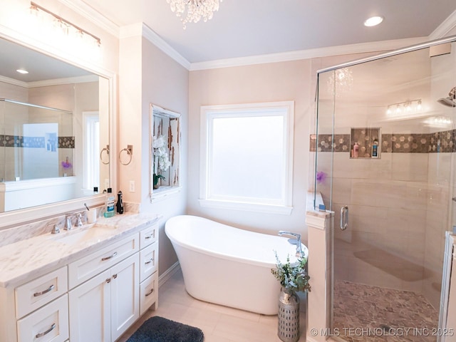 bathroom with ornamental molding, shower with separate bathtub, and vanity