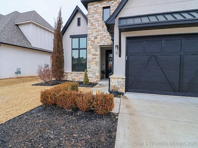 view of exterior entry with a garage