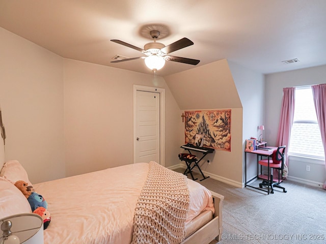 bedroom featuring vaulted ceiling, light colored carpet, and ceiling fan