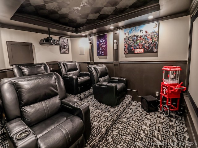 cinema room featuring crown molding and a tray ceiling