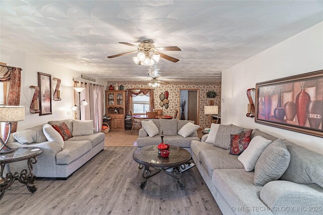 432756 E 320th Rd, Big Cabin, OK 74332 - living room featuring wallpapered walls, wood finished floors, and a ceiling fan