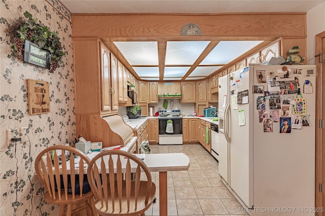 kitchen with white refrigerator with ice dispenser, light tile patterned floors, light brown cabinets, and range with electric stovetop