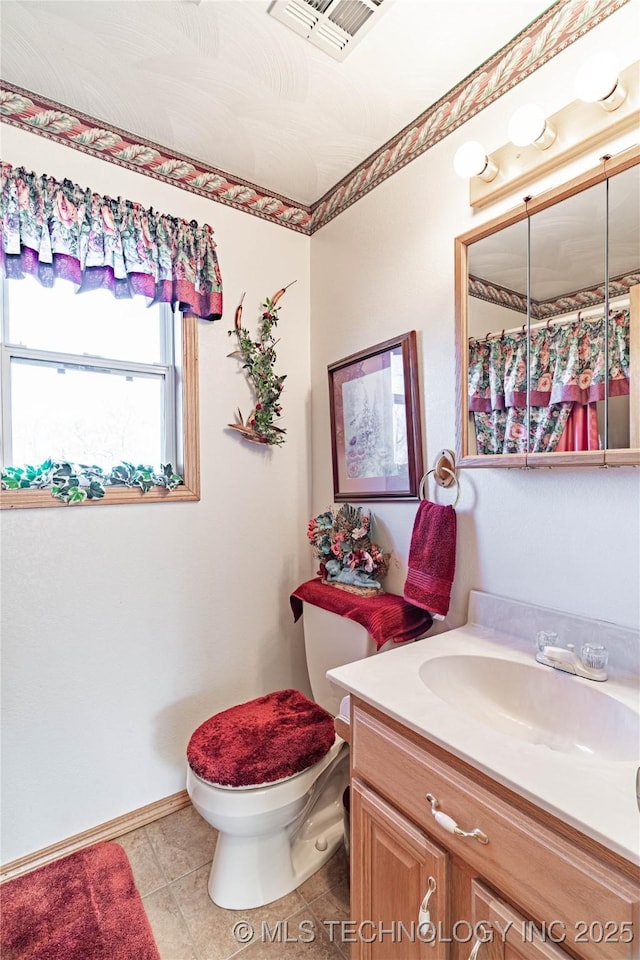 432756 E 320th Rd, Big Cabin, OK 74332 - bathroom featuring toilet, tile patterned floors, visible vents, baseboards, and vanity