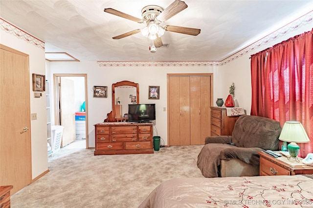 carpeted bedroom with ceiling fan