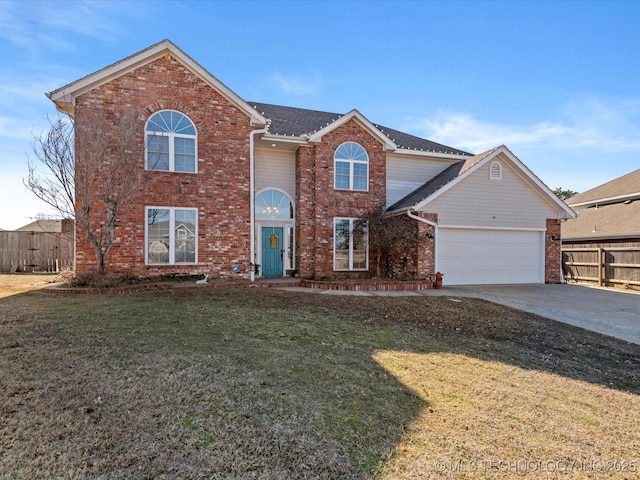 view of front property featuring a garage and a front lawn