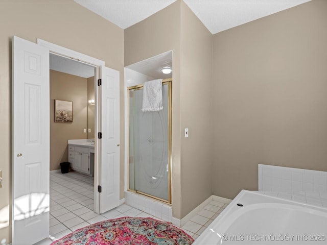 bathroom with vanity, separate shower and tub, and tile patterned flooring