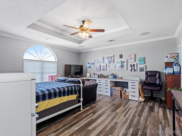 bedroom featuring crown molding, a textured ceiling, a raised ceiling, and ceiling fan