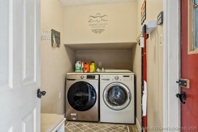 clothes washing area featuring washing machine and clothes dryer