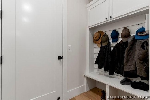 mudroom with light hardwood / wood-style floors