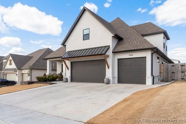 modern inspired farmhouse featuring a garage