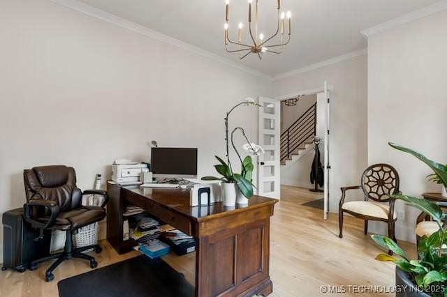 office space with ornamental molding, an inviting chandelier, and light hardwood / wood-style flooring