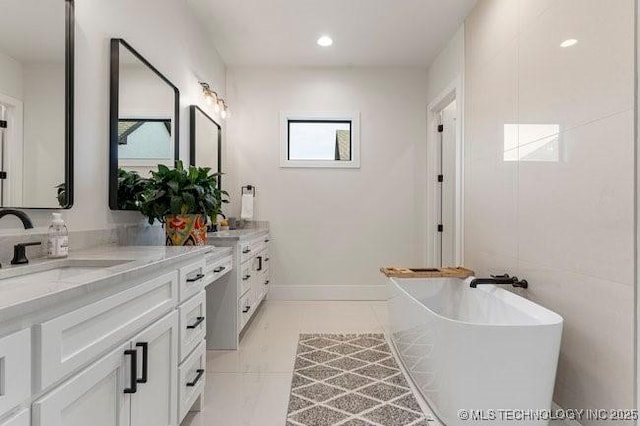 bathroom featuring vanity and a bathing tub