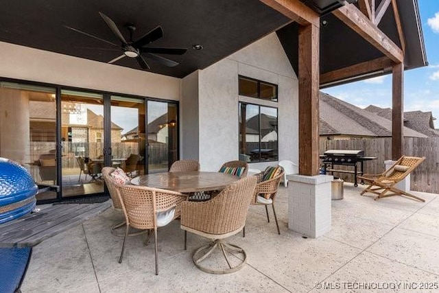 view of patio with grilling area and ceiling fan