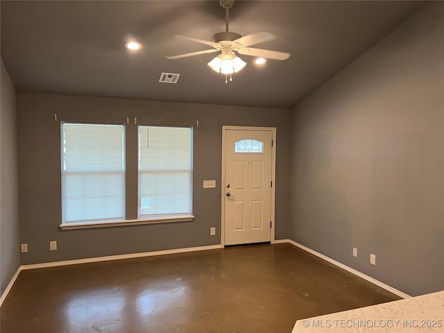 foyer entrance featuring ceiling fan and lofted ceiling