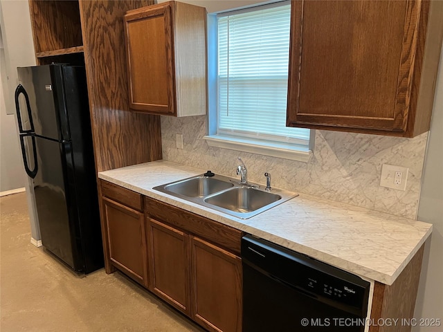 kitchen featuring tasteful backsplash, sink, and black appliances