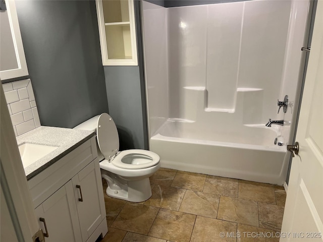 full bathroom featuring vanity, shower / tub combination, tasteful backsplash, and toilet