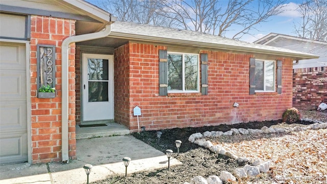 view of exterior entry featuring a garage