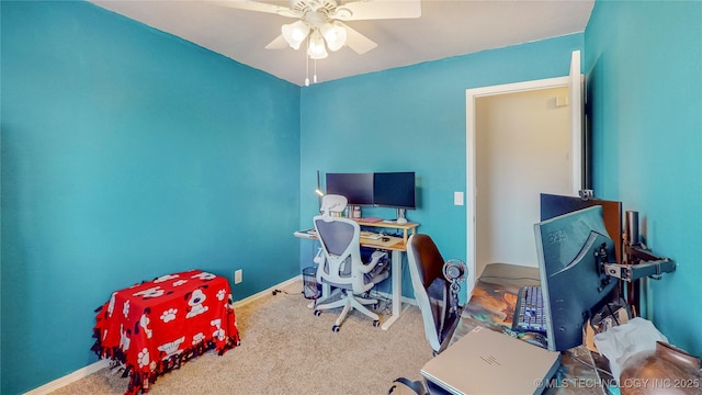 home office featuring ceiling fan and carpet flooring