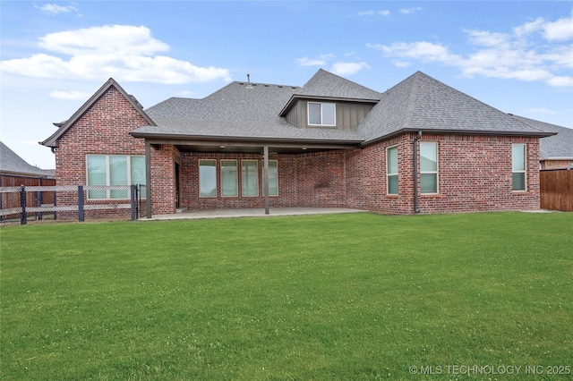 back of property featuring a yard and a patio area