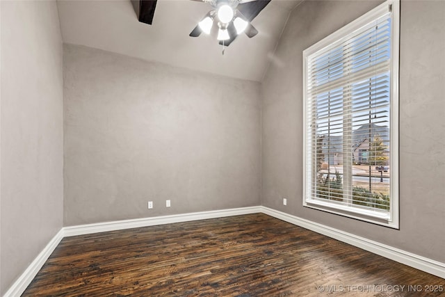 unfurnished room with lofted ceiling, dark hardwood / wood-style floors, and ceiling fan