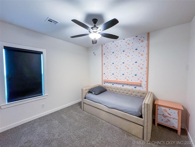 unfurnished bedroom with ceiling fan and carpet floors