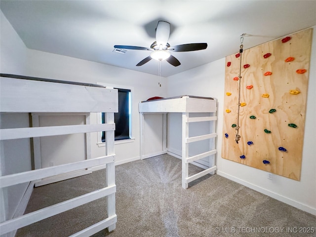 unfurnished bedroom featuring ceiling fan and carpet