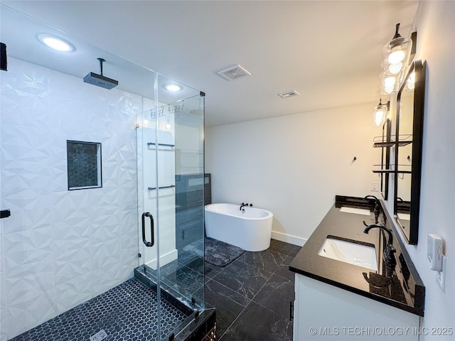 bathroom with vanity and separate shower and tub