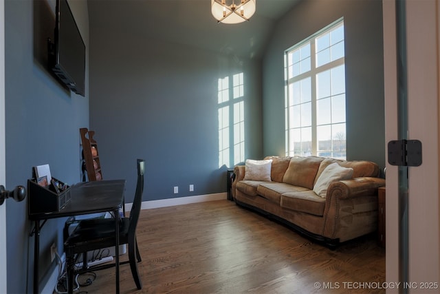 living room with lofted ceiling and dark hardwood / wood-style floors