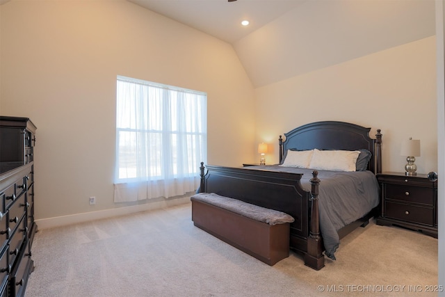 carpeted bedroom with vaulted ceiling