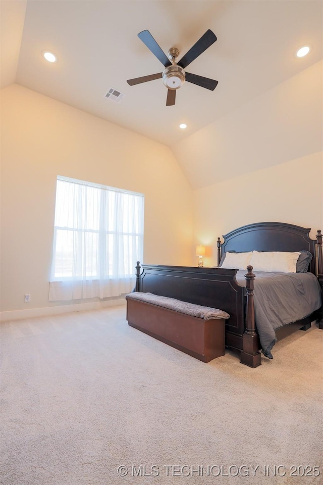 carpeted bedroom featuring lofted ceiling and ceiling fan