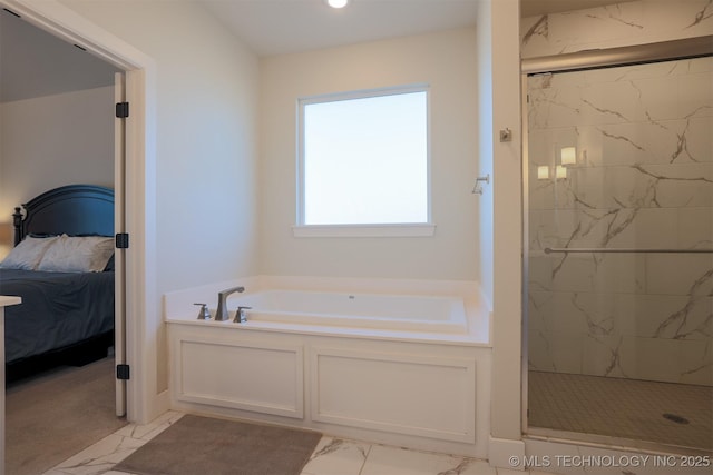 bathroom with shower with separate bathtub