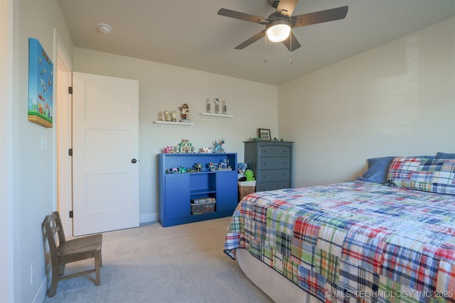 bedroom with ceiling fan and carpet floors