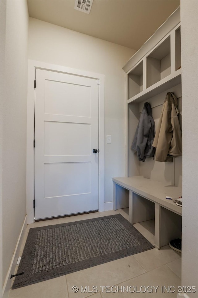 mudroom with light tile patterned flooring