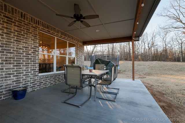 view of patio featuring ceiling fan