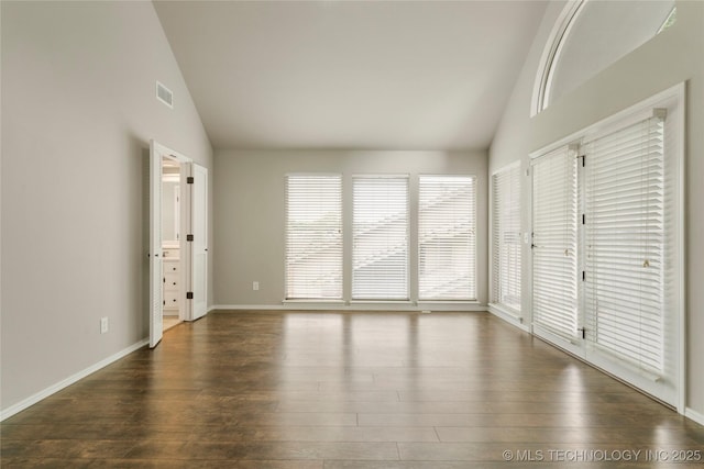 interior space with high vaulted ceiling and dark hardwood / wood-style flooring