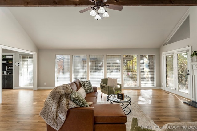 sunroom featuring lofted ceiling, a healthy amount of sunlight, and ceiling fan