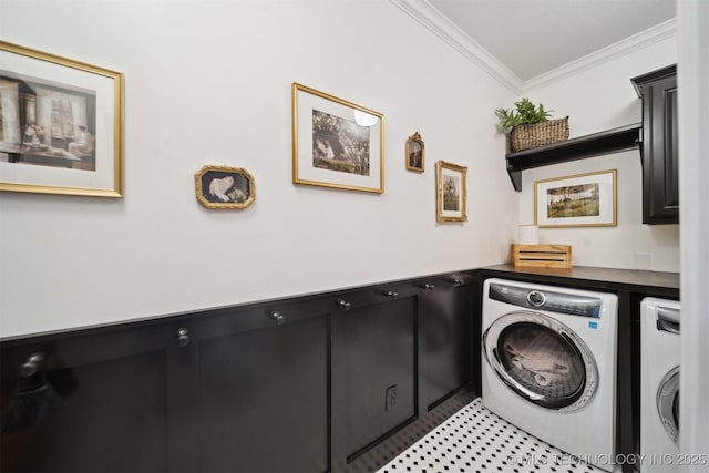 clothes washing area featuring crown molding and independent washer and dryer