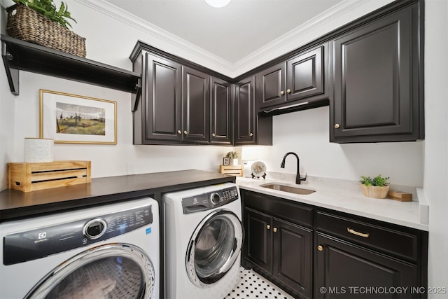 laundry area with cabinets, crown molding, washer and dryer, and sink