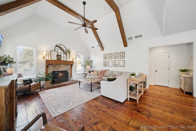 living room featuring a stone fireplace, dark wood-type flooring, high vaulted ceiling, and beamed ceiling