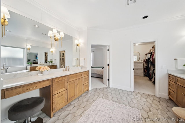 bathroom with vanity, ornamental molding, and an inviting chandelier