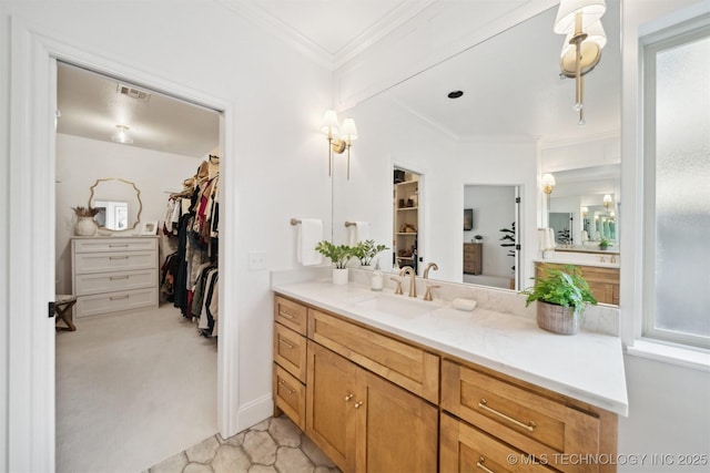 bathroom with crown molding and vanity