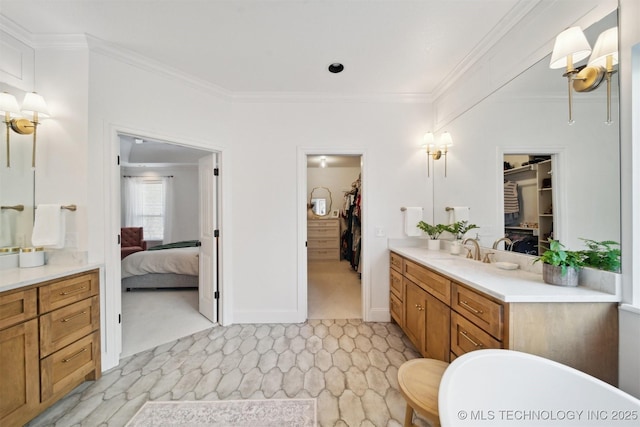 bathroom with crown molding, a bath, and vanity