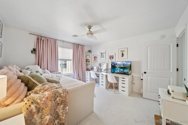 bedroom with light colored carpet and ceiling fan