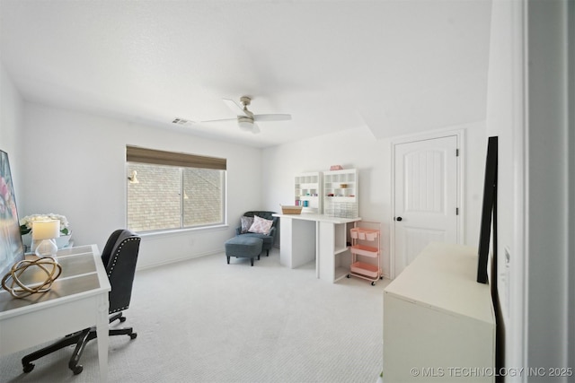 home office with ceiling fan and light colored carpet