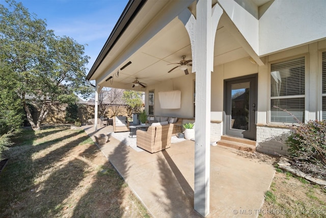 view of patio with outdoor lounge area and ceiling fan