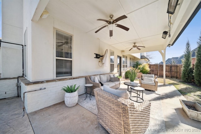 view of patio / terrace featuring ceiling fan and an outdoor living space